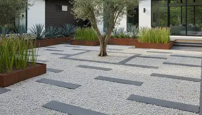 Modern minimalist pea gravel landscape with geometric lines in Greenville, NC by Chop Chop Landscaping